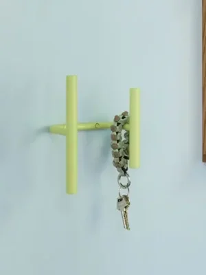 Nástěnný věšák Flip, světle zelený, šířka 20 cm, kov Novinka